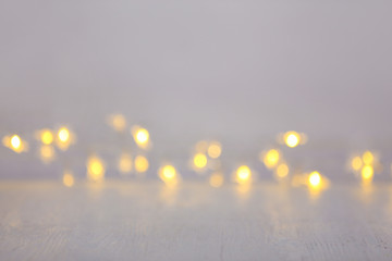 Closeup view of white table with blurred lights