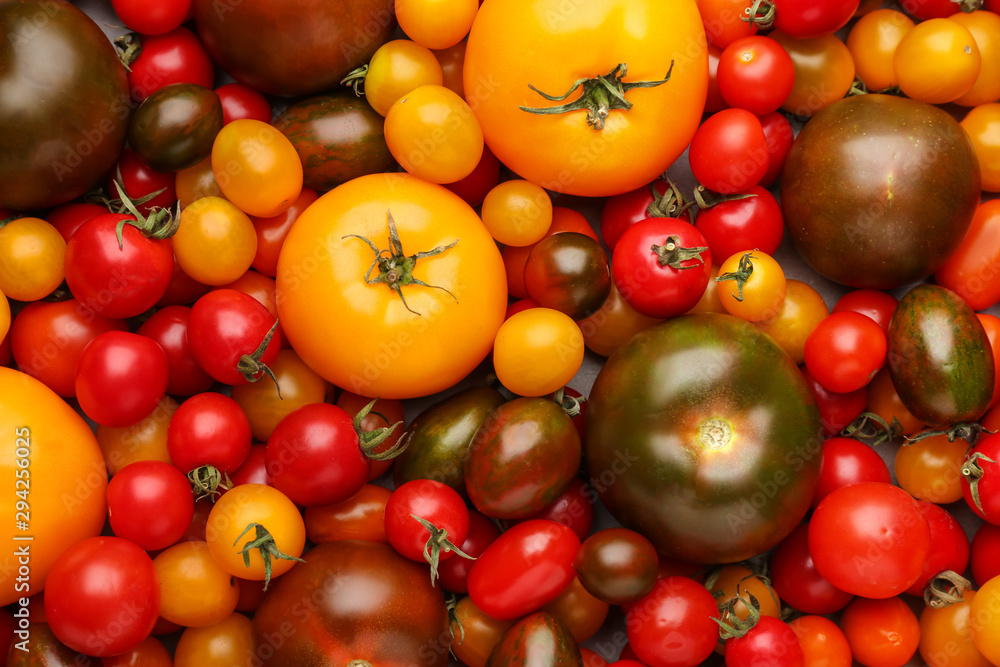 Different fresh tomatoes, top view