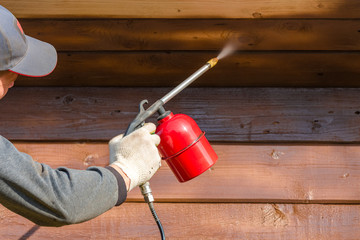 Woodworking with a protective coating using a spray gun