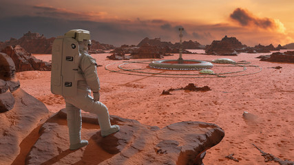 Wall Mural - astronaut on planet mars, looking at a habitat in the desert landscape