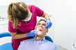 © MCStock - Young Dentist Woman Doing a Check Up to a Patient.