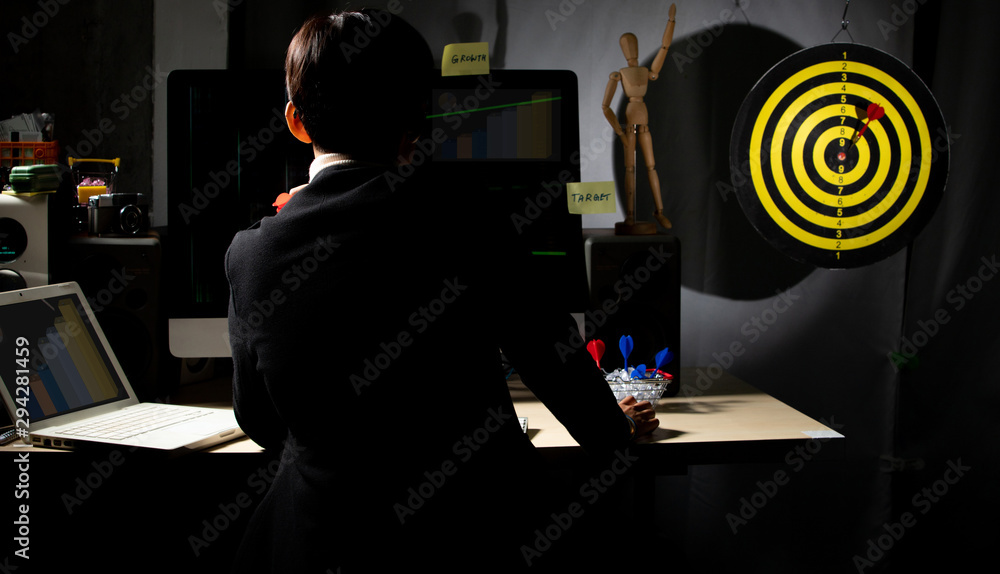 Business tomboy set dartboard as top Target and hand on computer ...