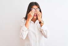 Young Beautiful Businesswoman Wearing Glasses Standing Over Isolated White Background Rubbing Eyes For Fatigue And Headache, Sleepy And Tired Expression. Vision Problem
