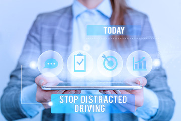 Writing note showing Stop Distracted Driving. Business concept for asking to be careful behind wheel drive slowly Female human wear formal work suit presenting smart device