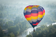 Colorful Hot Air Balloon Over The Rogue River In Grants Pass Oregon On A Beautiful Summer Morning