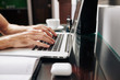 © DragonImages - Hands of male programming student working on laptop at his desk