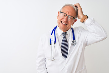 Poster - Senior grey-haired doctor man wearing stethoscope standing over isolated white background confuse and wonder about question. Uncertain with doubt, thinking with hand on head. Pensive concept.