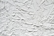 Decorative gray plaster effect on wall. Plaster texture. Closeup