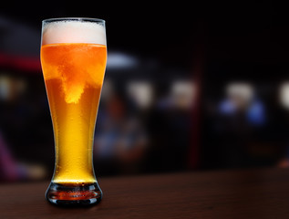 glass of beer on a street bar table.