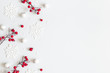 Christmas or winter composition. Snowflakes and red berries on gray background. Christmas, winter, new year concept. Flat lay, top view, copy space