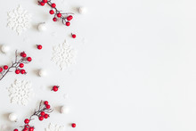 Christmas Or Winter Composition. Snowflakes And Red Berries On Gray Background. Christmas, Winter, New Year Concept. Flat Lay, Top View, Copy Space