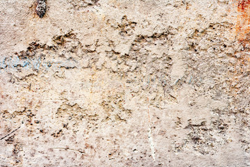 Texture of a concrete wall with cracks and scratches which can be used as a background