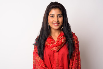 Face of happy young Persian woman smiling in traditional clothing