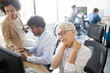 © NDABCREATIVITY - Mature business woman having stress and headache in the office