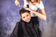 © Victor - Beautiful boy getting a haircut with scissors