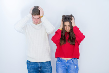 Sticker - Beautiful young couple over white isolated background suffering from headache desperate and stressed because pain and migraine. Hands on head.