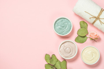 Wall Mural - clay mask on pink bakground, skincare product.