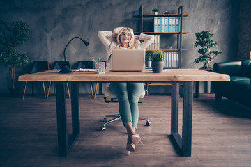 Photo of happy cheerful positive company leader boss wearing heeled shoes glasses holding head with hands enjoying her free time at work