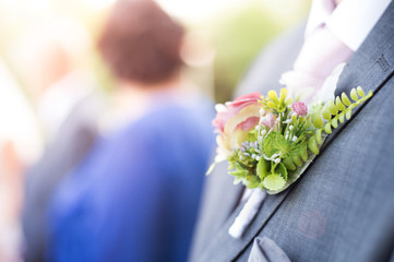 Wall Mural - Small wedding bouquet on groom's tuxedo