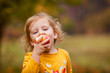 © Lena May - Cute little girls eating red delicious apple