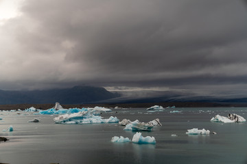 Sticker - Fragments of iceberg in sea water. Iceland north sea