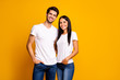 © deagreez - Photo of nice couple hugging ready for first working day reliable people wear casual clothes isolated yellow color background
