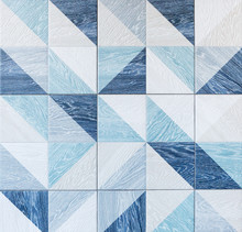 Modern Ceramic Tile With Geometric Pattern And Imitation Of Wood Texture In Gray And Light Blue Colors.