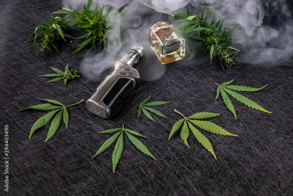 Cannabis liquid. Vape CBD or THC, Vaping Marijuana and Hemp. Against a Dark  Background. Cloud of steam. Horizontal orientation Stock Photo | Adobe Stock