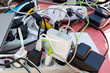 © Olya - bunch of charging gadgets, electronic devices, messy wires. dependence on electricity