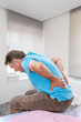 © JPC-PROD - Senior male suffering sharp back pain, sick person getting up from bed, after rest