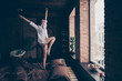 Full length body size view of her she nice attractive graceful careless slender cheerful cheery dreamy girl dancing on bed having fun at industrial brick wood loft modern interior style flat house