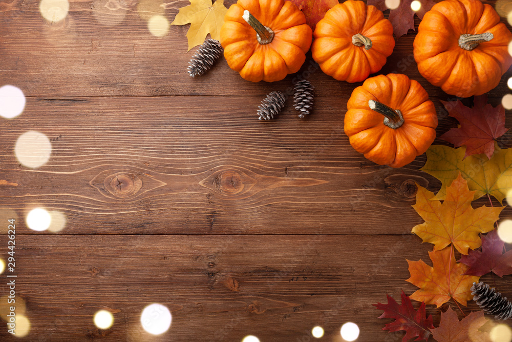 Autumn Thanksgiving background. Pumpkins and leaves on wooden table top ...
