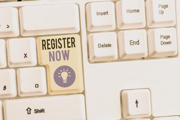 Word writing text Register Now. Business photo showcasing official list or record showing or things into web or forum White pc keyboard with empty note paper above white background key copy space