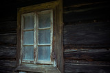 Fototapeta  - Old creepy scary window on wooden house. Halloween, haunted house concept.