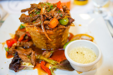 Delicious Puerto Rican Mofongo with Steak and Garlic Sauce.