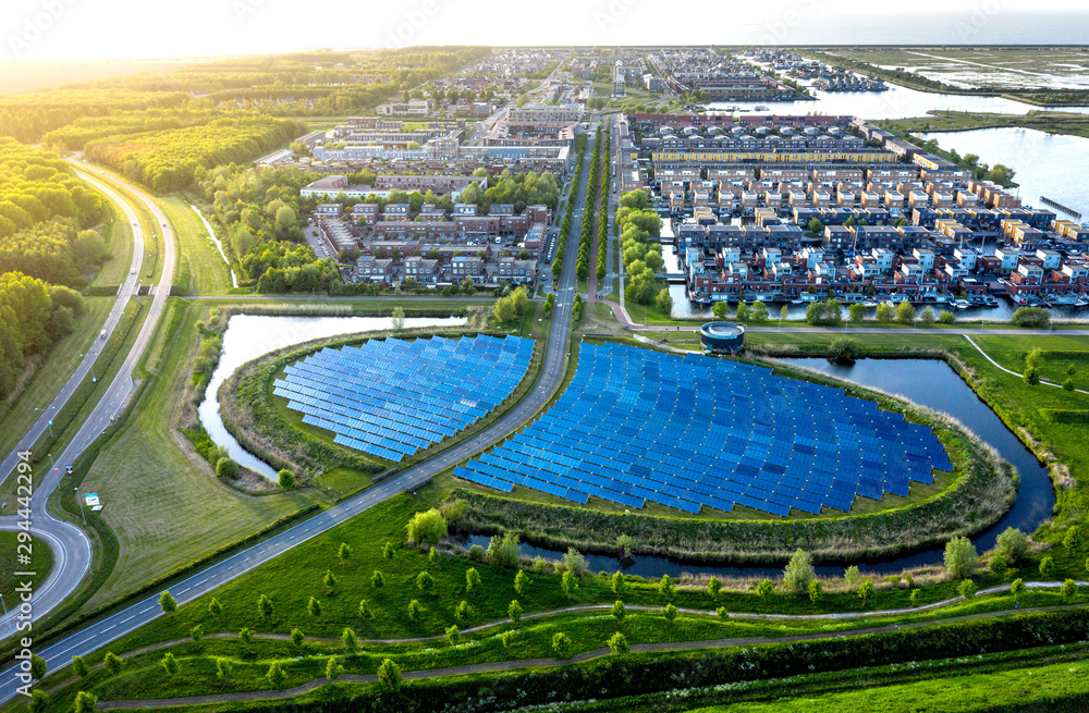 Aerial shot of a modern sustainable neighbourhood in Almere, The Netherlands - obrazy, fototapety, plakaty 