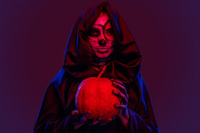Creepy Ghost With Pumpkin Under Red Light