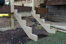 Structure Of New Stairs Being Constructed On A Backyard Home Deck