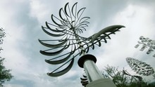 Modern Wind Spinner In A Garden Moving Fast On The Wind