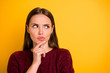 © deagreez - Close up photo of attractive charming pretty cute girl touching her chin while pondering over something being isolated with yellow background