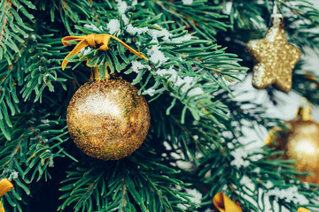 Wall Mural - Green fir tree with golden balls. Christmas wallpaper.