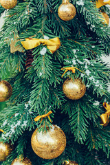 Wall Mural - Green fir tree with golden balls. Christmas wallpaper.