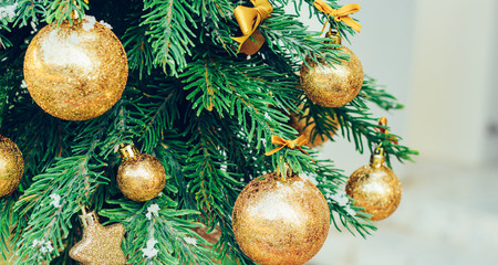 Wall Mural - Green fir tree with golden balls. Christmas wallpaper.
