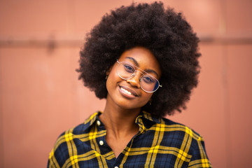 Wall Mural - Close up front beautiful young african american woman with glasses