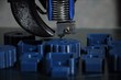 Close-up of 3D printed parts made of blue plastic and the print head of the printer