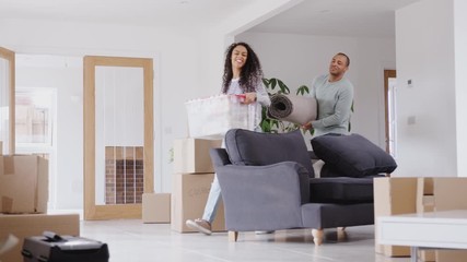 Wall Mural - Loving Couple Carrying Boxes Into New Home On Moving Day