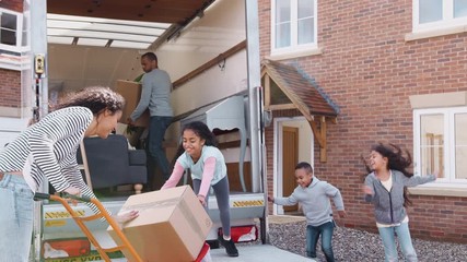 Wall Mural - Family Unloading Furniture From Removal Truck Into New Home