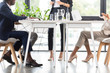 © LIGHTFIELD STUDIOS - cropped view of businesspeople at table in office