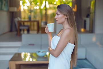 Sticker - Young sexy girl in the morning in a towel with a cup of tea