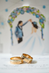 Wall Mural - Gold wedding rings for newlyweds on wedding day